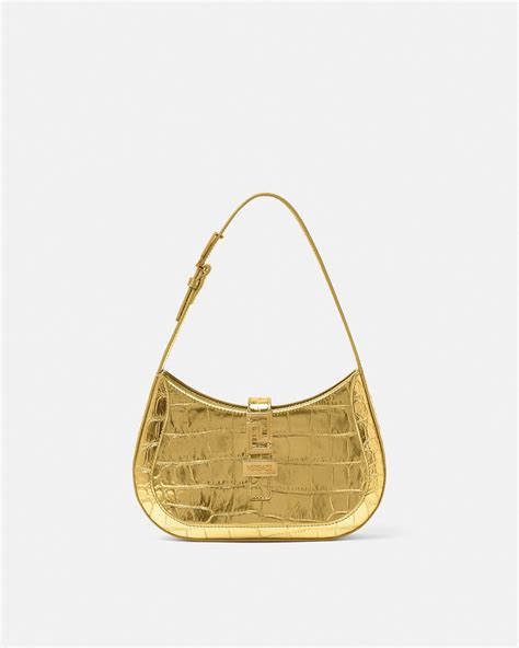 versace shiny gold pouch|Versace hobo bags.